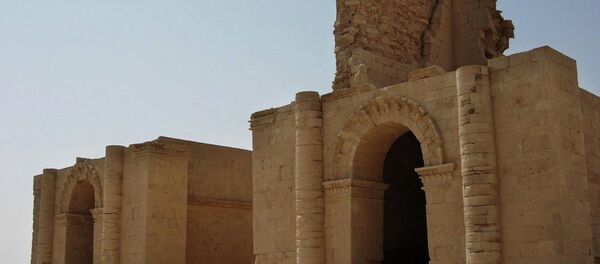 In this file photo taken July 27, 2005, two temples stand over 1,750 years after the Sassanian empire razed the Mesopotamian city of Hatra, 320 kilometers (200 miles) north of Baghdad, Iraq. - Sputnik Mundo
