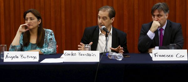 Members of the Inter-American Human Rights Commission (CIDH) Angela Buitrago (L-R), Carlos Beristain and Francisco Cox attend a news conference in Mexico City - Sputnik Mundo