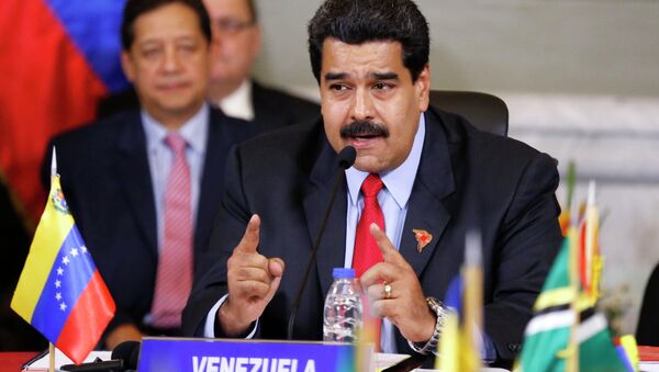 Venezuela's President Nicolas Maduro speaks during an ALBA alliance summit in Caracas March 17, 2015. Leaders of Latin America's left-wing ALBA bloc of nations (Bolivarian Alliance for the Peoples of Our America) are holding an extraordinary meeting in Caracas on Tuesday to express their support for Venezuela after Washington declared the oil-rich country a national security threat on Monday, March 9, and ordered sanctions against seven officials from the South American nation. REUTERS/Carlos Garcia Rawlins - Sputnik Mundo