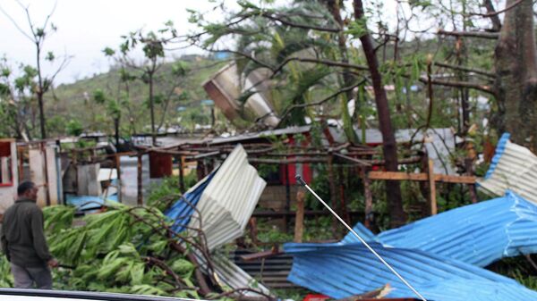 Debris is scattered over a building in Port Vila, Vanuatu, Saturday, March 14, 2015, in the aftermath of Cyclone Pam - Sputnik Mundo
