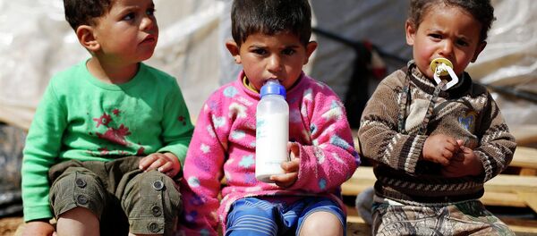 Syrian refugee children are seen in an informal tented settlement in Madaba city, near Amman March 13, 2015. - Sputnik Mundo