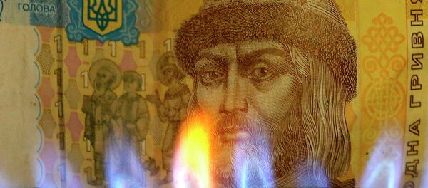 Billete de una grivna con una llama de gas Billete de una grivna con una llama de gas - Sputnik Mundo