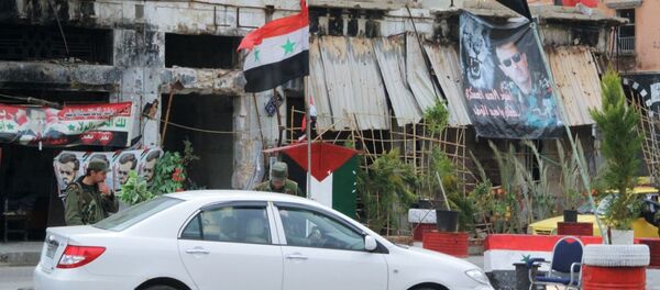 Блокпост сирийской армии на одной из улиц в центре Хомса Блокпост сирийской армии на одной из улиц в центре Хомса - Sputnik Mundo