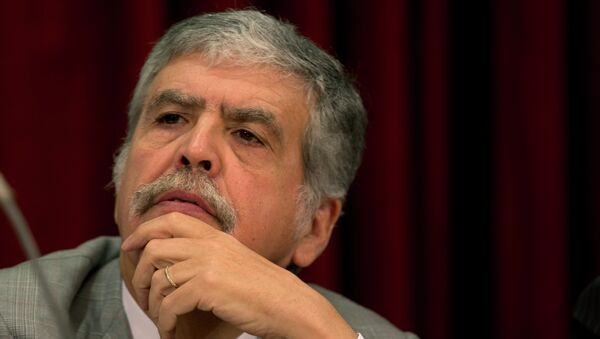 Argentina's Planning Minister Julio de Vido listens to Economy Minister Hernan Lorenzino and Deputy Economy Minister Axel Kicillof at a joint news conference in Buenos Aires, Argentina, Wednesday, Nov. 14, 2012. - Sputnik Mundo