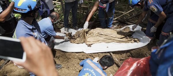 Uno de los cuerpos hallados en Tailandia - Sputnik Mundo