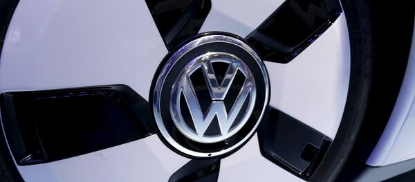 The Volkswagen logo is seen on their XL1 car during media day at the Paris Mondial de l'Automobile, in this file picture taken October 3, 2014. - Sputnik Mundo