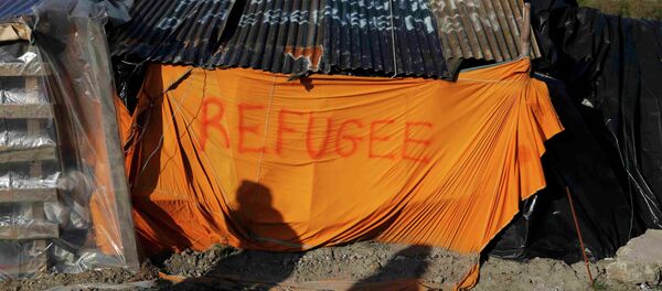 Campo de refugiados africanos en Francia - Sputnik Mundo