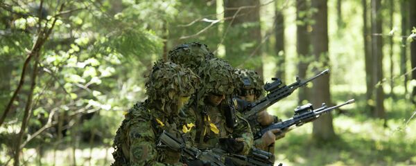 Soldados estonios participando en los ejercicios militares de la OTAN Soldados estonios participando en los ejercicios militares de la OTAN - Sputnik Mundo