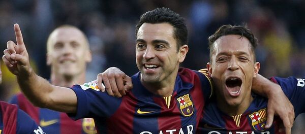 Xavi Hernández (izda.) - Sputnik Mundo