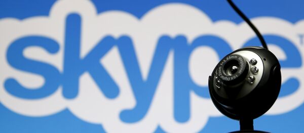A web camera is seen in front of a Skype logo in this photo illustration taken in Zenica, May 26, 2015 - Sputnik Mundo
