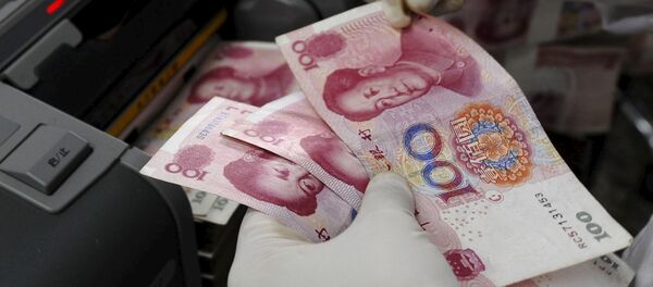 Banknotes at a branch of Bank of China in Changzhi, Shanxi province in this September 16, 2008 - Sputnik Mundo