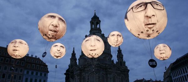 Globos con rostros de los líderes del G7 - Sputnik Mundo
