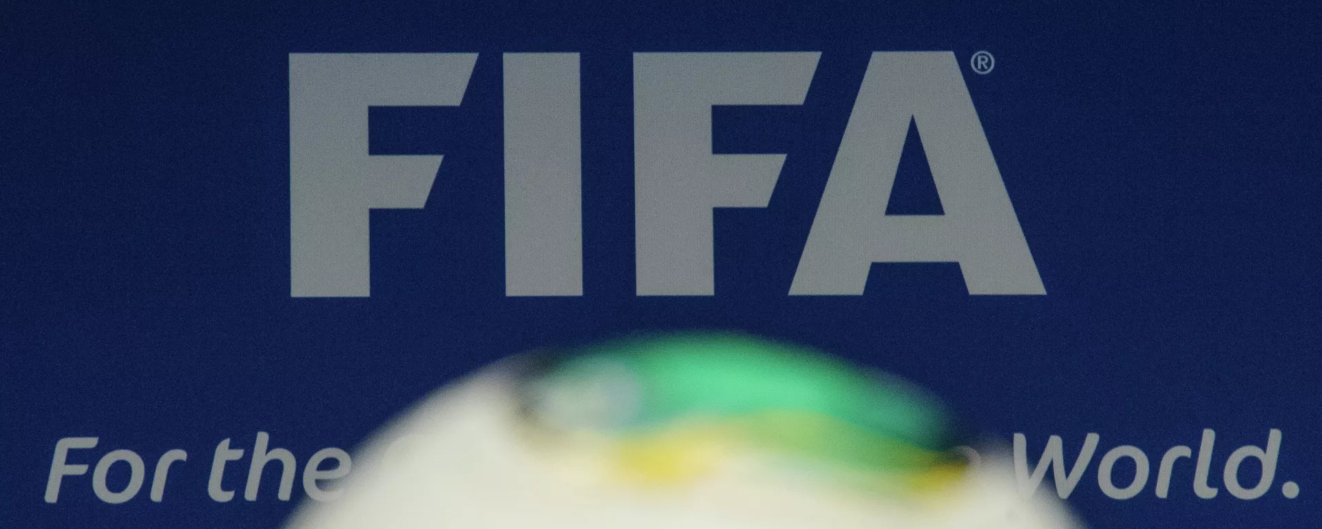 The FIFA logo is pictured behind a ball during the press conference following the meeting of the FIFA executive comittee in Zurich The FIFA logo is pictured behind a ball during the press conference following the meeting of the FIFA executive comittee in Zurich - Sputnik Mundo, 1920, 26.10.2023