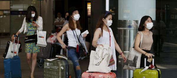 Turistas de Corea del Sur en el aeropuerto de Hong Kong - Sputnik Mundo