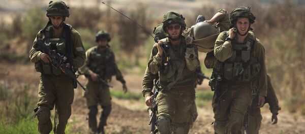 Soldados israelíes al lado de la frontera de Franja de Gaza Soldados israelíes al lado de la frontera de Franja de Gaza - Sputnik Mundo