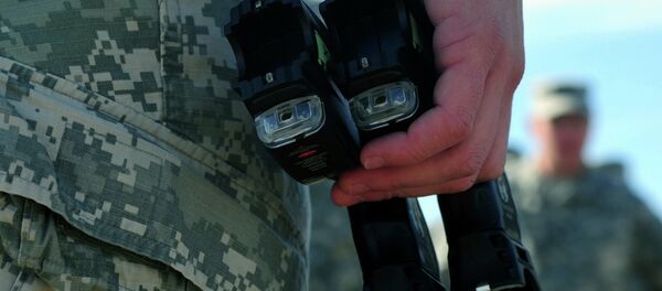 Pistola eléctrica Taser - Sputnik Mundo