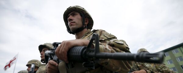 Georgian servicemen attend an opening ceremony for the military exercise Agile Spirit 2015 in Vaziani, Georgia, July 8, 2015. - Sputnik Mundo