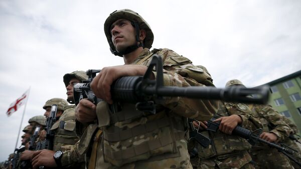 Georgian servicemen attend an opening ceremony for the military exercise Agile Spirit 2015 in Vaziani, Georgia, July 8, 2015. - Sputnik Mundo