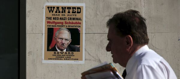 Póster con rostro de Wolfgang Schauble, ministro de Finanzas de Alemania, en Atenas, Grecia, el 13 de julio, 2015 - Sputnik Mundo