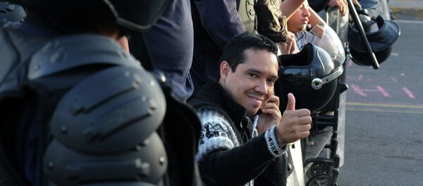 Un miembro del movimiento hondureño de oposición indignada, Ariel Varela Un miembro del movimiento hondureño de oposición indignada, Ariel Varela - Sputnik Mundo