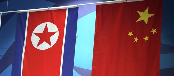 Banderas de China y Corea del Norte - Sputnik Mundo