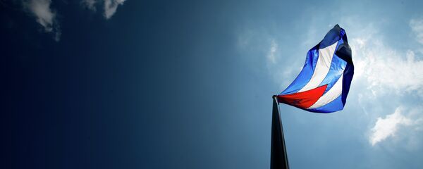 The Cuban flag over their new embassy in Washington, Monday, July 20, 2015. The Cuban flag over their new embassy in Washington, Monday, July 20, 2015. - Sputnik Mundo