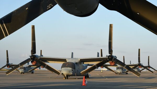 Multi-mission tiltrotor Osprey aircraft at the US Marine's Camp Futenma in a crowded urban area of Ginowan, Okinawa prefecture - Sputnik Mundo