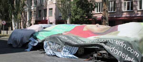 Coches quemados de la OSCE en Donetsk - Sputnik Mundo