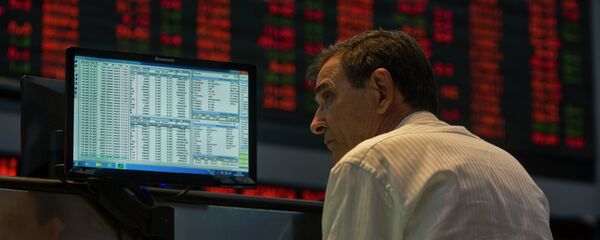 A system operator at Sao Paulo's Stock Exchange (Bovespa) looks at a monitor, in Sao Paulo, Brazil, on October 2, 2013. A system operator at Sao Paulo's Stock Exchange (Bovespa) looks at a monitor, in Sao Paulo, Brazil, on October 2, 2013. - Sputnik Mundo