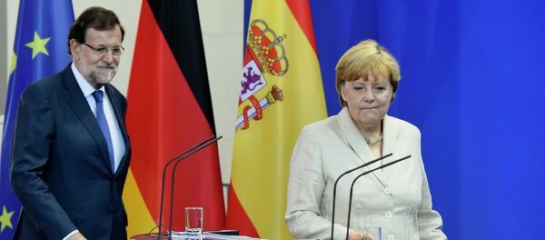 El presidente del Gobierno de España, Mariano Rajoy, y canciller de Alemania, Angela Merkel - Sputnik Mundo