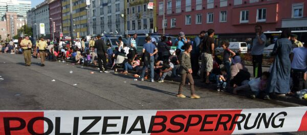 Refugiados en Múnich tras llegar desde Hungría y Austria - Sputnik Mundo