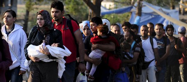 Migrantes - Sputnik Mundo