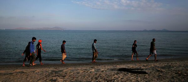 Migrantes - Sputnik Mundo