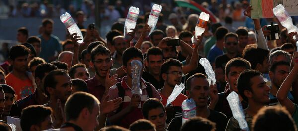 Migrantes - Sputnik Mundo