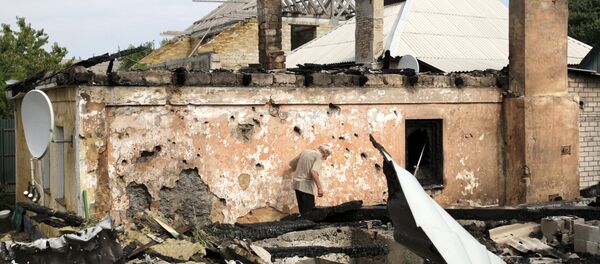 Consecuencias del bombardeo en Donetsk Consecuencias del bombardeo en Donetsk - Sputnik Mundo