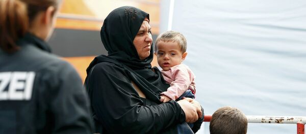 Migrantes en el estación de trenes en Munich, Alemania - Sputnik Mundo