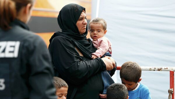 Migrantes en el estación de trenes en Munich, Alemania - Sputnik Mundo