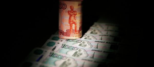 Russian rouble banknotes are seen in this file illustration picture taken in Moscow September 30, 2014. - Sputnik Mundo