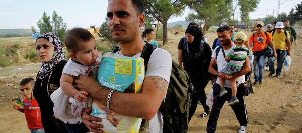 Refugiados sirios en la frontera entre Grecia y Macedonia (archivo) - Sputnik Mundo