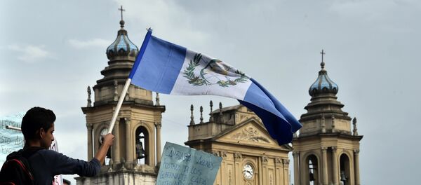 Una marcha de protesta en Guatemala Una marcha de protesta en Guatemala - Sputnik Mundo