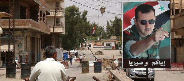 El retrato del presidente de Siria, Bashar Asad - Sputnik Mundo