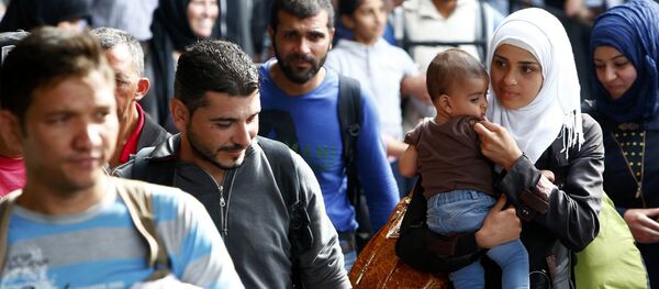 Refugiados llegan a Alemania Refugiados llegan a Alemania - Sputnik Mundo