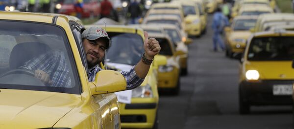 Protesta contra el servicio Uber en Bogotá, Colombia - Sputnik Mundo