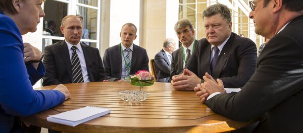 Angela Merkel, Vladímir Putin, Petró Poroshenko y Francois Hollande durante la cumbre del Cuarteto de Normandía - Sputnik Mundo