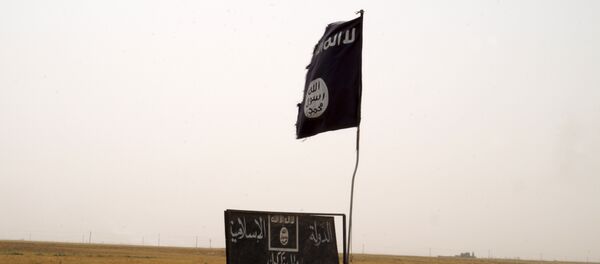 La bandera del grupo terrorista Daesh - Sputnik Mundo