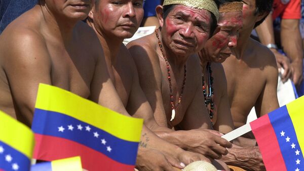 Jibi indigenous men hold Venezuelan flags as they wait for Venezuelan President Hugo Chavez to arrive at the National Pantheon in Caracas, Venezuela - Sputnik Mundo