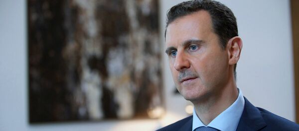 Syrian President Bashar Assad, speaking during an interview with the Iran's Khabar TV, in Damascus, Syria, Sunday, Oct. 4, 2015 - Sputnik Mundo