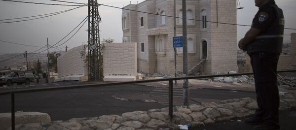 Muro de hormigón en el barrio palestino de Jabel Mukaber - Sputnik Mundo