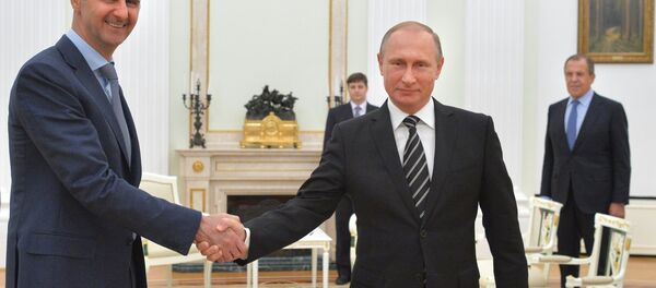 Presidente de Siria, Bashar Asad, y presidente de Rusia, Vladímir Putin, durante el encuentro en el Kremlin, el 21 de octubre, 2015 - Sputnik Mundo