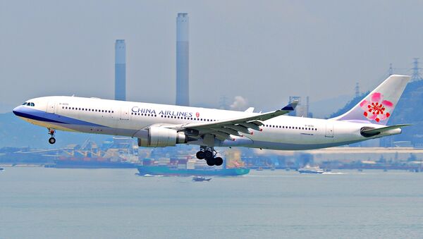 Un avión de la compañía aérea China Airlines - Sputnik Mundo